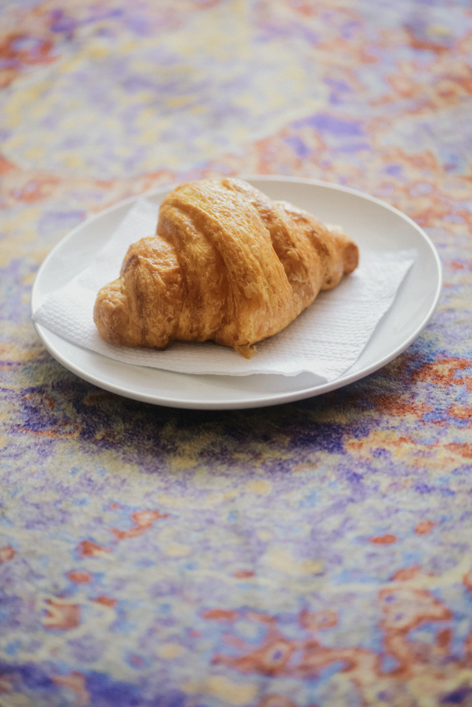 Golden butter croissants on a plate