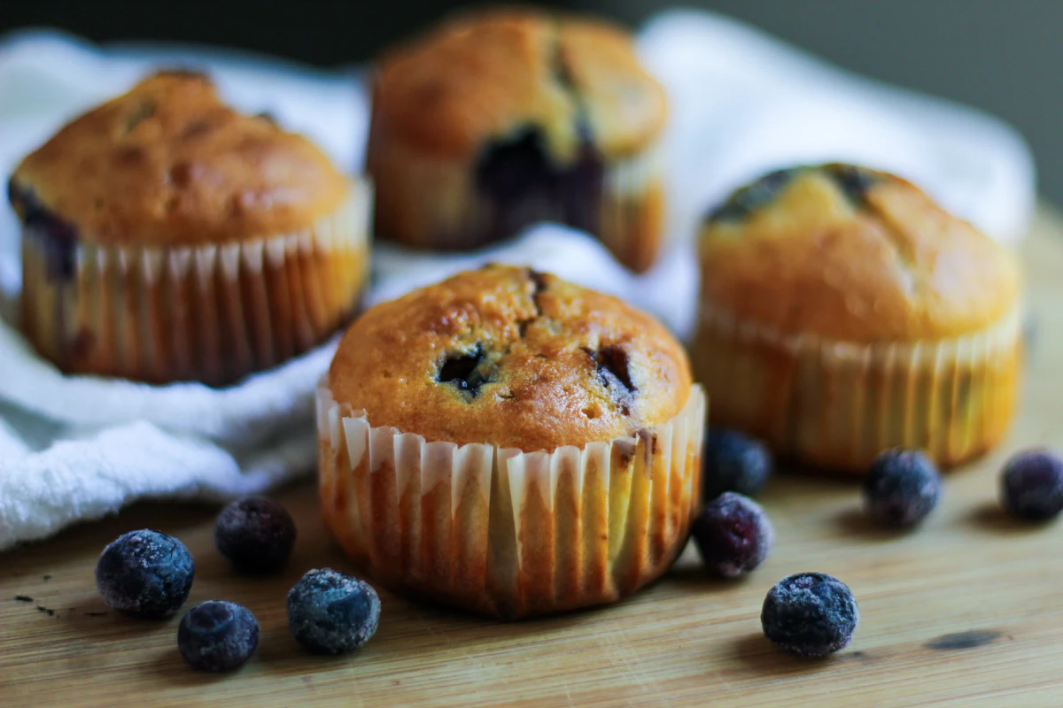 Blueberry walnut muffins shown in an illustrative food photograph