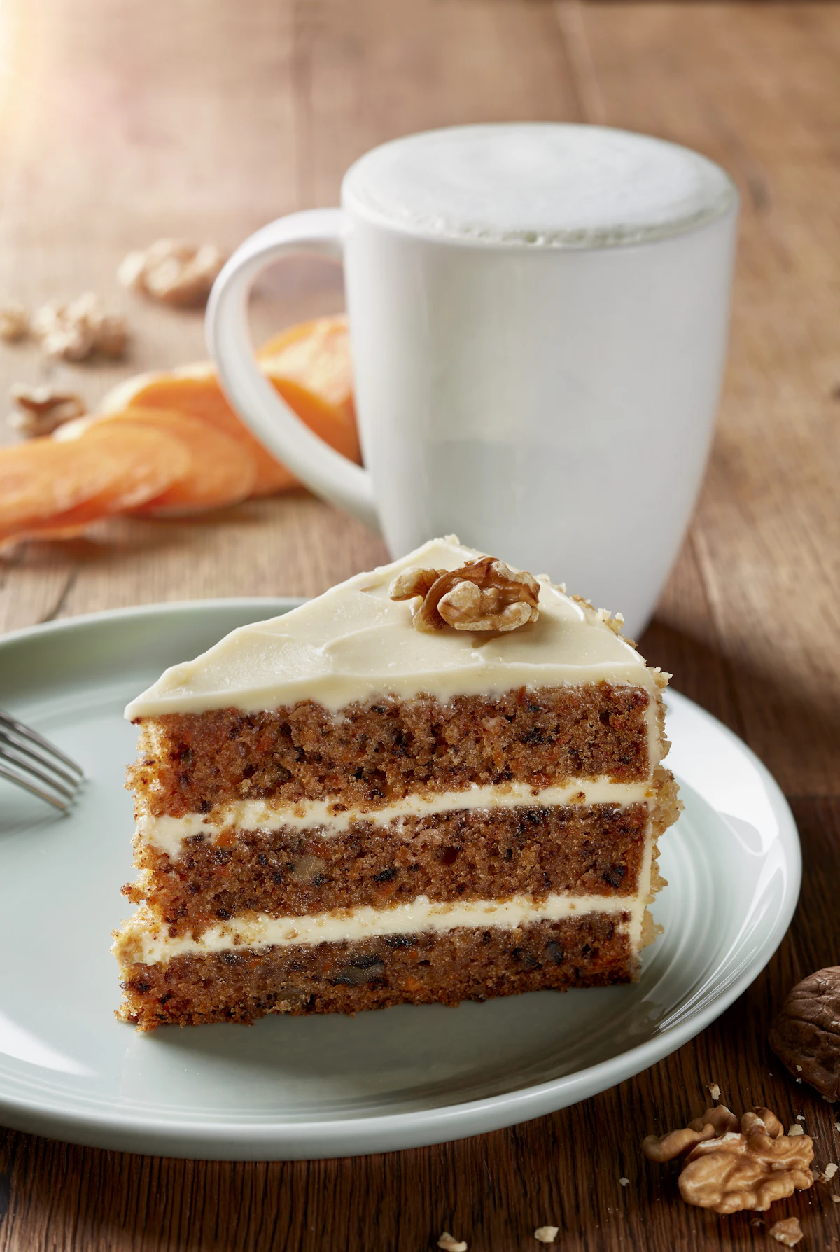 Carrot layer cake shown in an illustrative food photograph