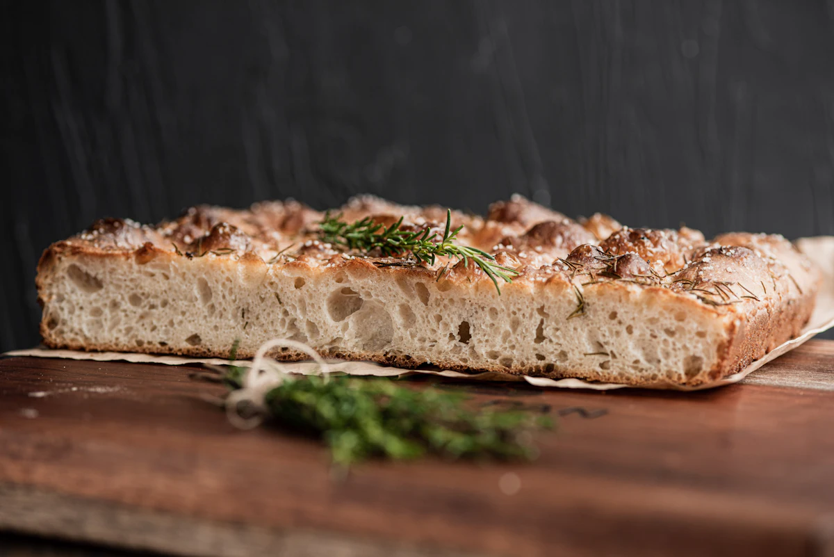 Rosemary focaccia shown in an illustrative food photograph