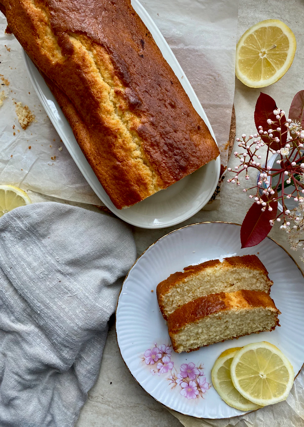 Lemon drizzle cake shown in an illustrative food photograph